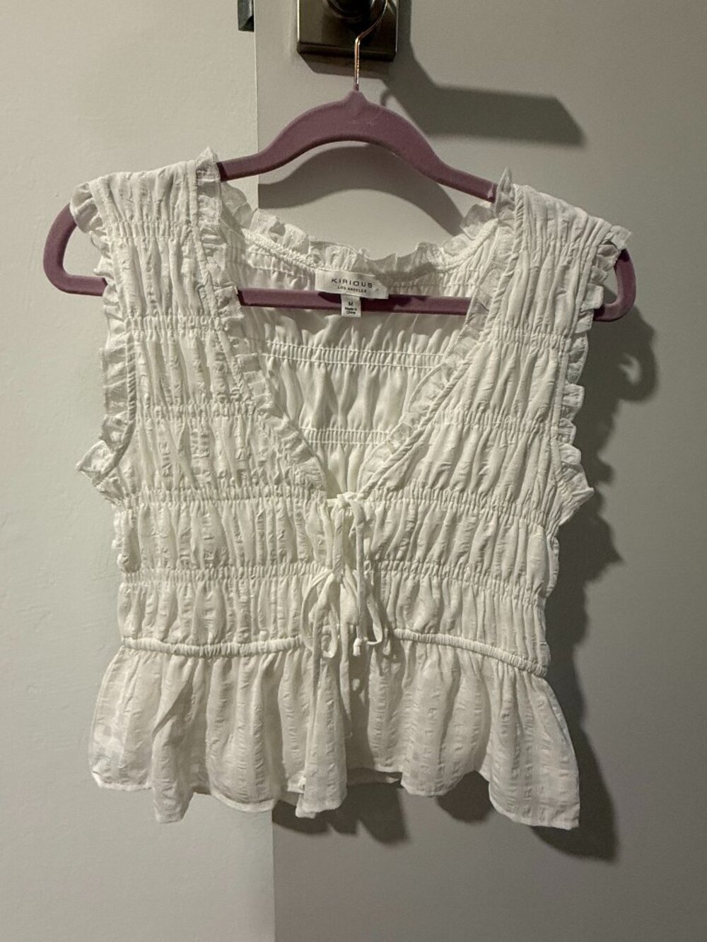 White ruffled top